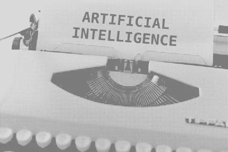 une feuille dans une ancienne machine à écrire sur laquelle est écrit "Artificial Interlligence"